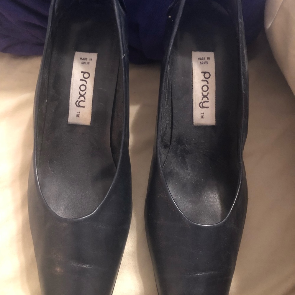 Proxy. Blue pumps. Bow accent in the back.